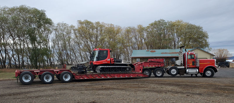 snow cat hauling carrell crane